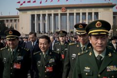 Military delegates leave a session of the Chinese People's Political Consultative Conference in Beijing on March 4, 2017. China will raise defence spending by "around seven percent" this year as it guards against "outside meddling" in its disputed territorial claims in Asian waters, a top official said on March 4, 2017. / AFP PHOTO / NICOLAS ASFOURI