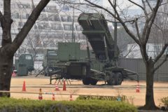 A PAC-3 surface-to-air missile launcher unit (C), used to engage incoming ballistic missile threats, is seen in position at the Defence Ministry in Tokyo on March 6, 2017. Three of the four missiles North Korea launched March 6 landed in Japanese-controlled waters, Prime Minister Shinzo Abe said, calling the development a "new stage of threat". / AFP PHOTO / KAZUHIRO NOGI