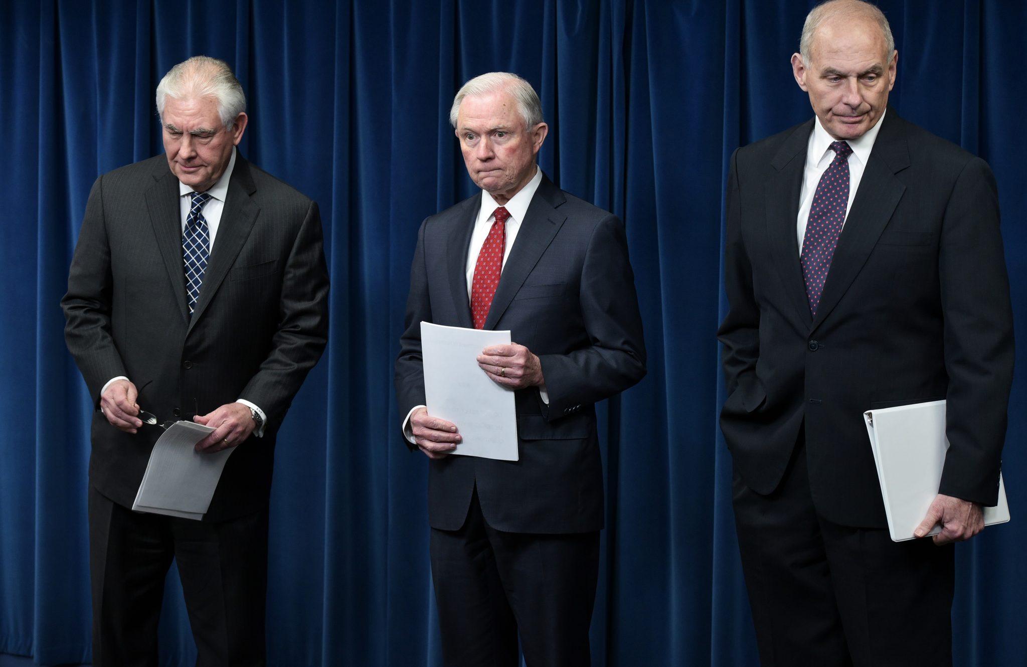 (L-R) US Secretary of State Rex Tillerson, Attorney General Jeff Sessions, and Homeland Security Secretary John Kelly arrive to deliver remarks on visa travel at the US Customs and Border Protection Press Room in the Reagan Building on March 6, 2017 in Washington, DC. US President Donald Trump signed a revised ban on travelers from six Muslim-majority nations Monday -- one with a reduced scope so Iraqis and permanent US residents are exempt. The White House said Trump signed the order -- which temporarily freezes new visas for Syrians, Iranians, Libyans, Somalis, Yemenis and Sudanese citizens -- behind closed doors "this morning". / AFP PHOTO / MANDEL NGAN