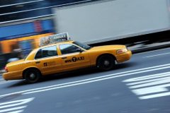 (FILES) This file photo taken on February 28, 2012 shows a New York yellow cab taxi driving up Fifth Avenue. Yellow taxi cabs have significantly fewer accidents than cabs of a darker hue, according to research that scientists say could end up saving lives and money. A study published on March 6, 2017 in the journal PNAS showed canary yellow cabs in Singapore were nine percent less likely to get into fender-benders or serious smash-ups than taxis that were deep blue. / AFP PHOTO / STAN HONDA