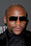 (FILES) This file photo taken on February 27, 2017 shows former US boxer Floyd Mayweather  prior to his 40th Birthday celebration in Los Angeles, California, on February 25, 2017. Floyd Mayweather taunted Conor McGregor over his failure to agree terms on their potential superfight on March 7, 2017, insisting once more he was ready to climb into a ring with the mixed martial arts star. "If Conor McGregor really wants this fight to happen, stop blowing smoke up everybody's ass," Mayweather told ESPN, accusing the Irishman of stalling on a deal."Sign the paper. Sign the paper. You said you were boss, so just sign the paper and let's make it happen."  / AFP PHOTO / TIBRINA HOBSON