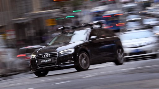 An Audi car drives through the streets of Sydney on March 8, 2017. Australia's consumer watchdog has launched court action against Volkswagen and its subsidiary Audi over an emissions cheating scandal, claiming they engaged in misleading or deceptive conduct. / AFP PHOTO / WILLIAM WEST