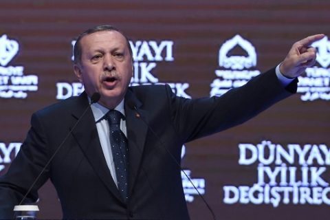 Turkish President Recep Tayyip Erdogan gestures as he speaks in Istanbul on March 12, 2017. Turkey's President Recep Tayyip Erdogan on March 12 threatened that the Netherlands would "pay a price" after expelling a Turkish minister from the country. / AFP PHOTO / OZAN KOSE