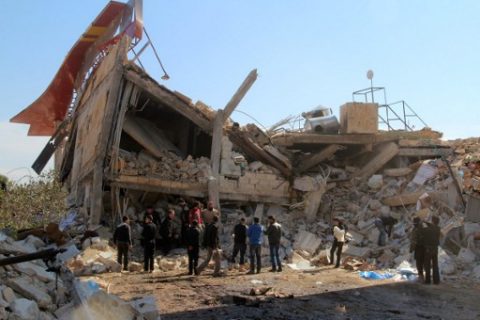 (FILES) This file photo taken on February 15, 2016 shows people gathering around the rubble of a hospital supported by Doctors Without Borders (MSF) near Maaret al-Numan, in Syria's northern province of Idlib, after the building was hit by suspected Russian air strikes. More than 800 health workers have died in "acts of war crimes" in Syria since 2011, in hospital bombings, shootings, torture and executions perpetrated mainly by government-backed forces, researchers said on March 15, 2017. / AFP PHOTO / AL-MAARRA TODAY / GHAITH OMRAN