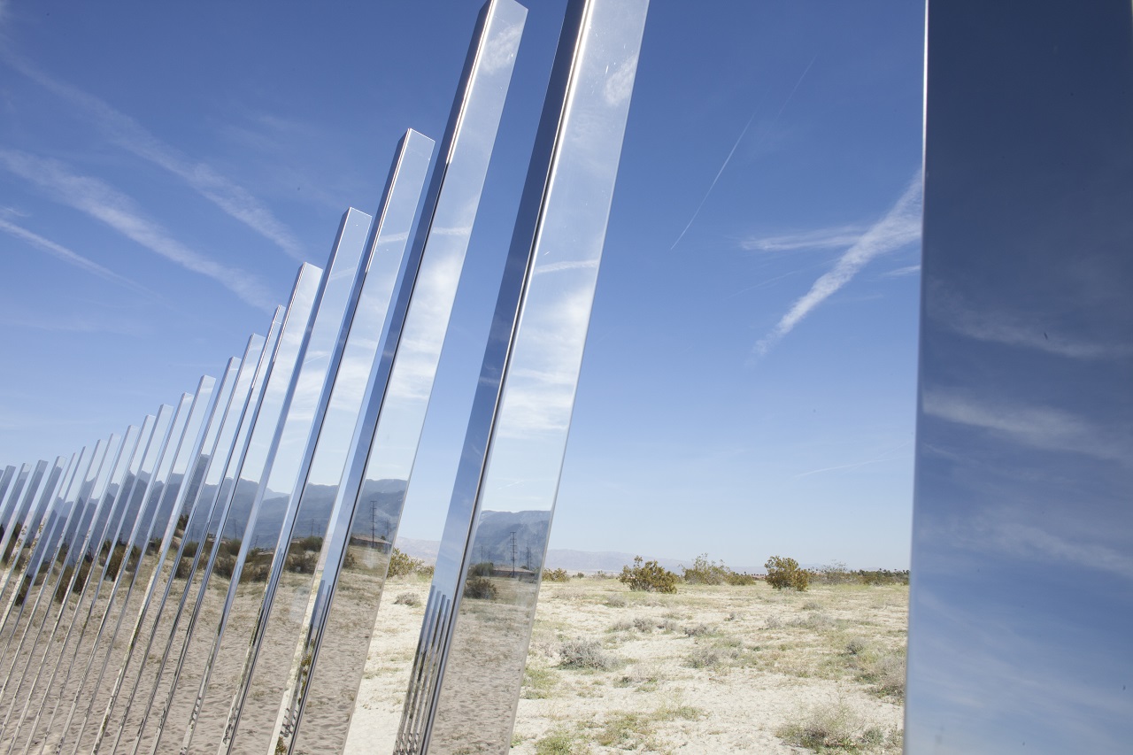 The Circle of Land and Sky from the Desert X land art exhibit in the Coachella Valley of California is viewed on March 16, 2017.  A house made of mirrors pops out of the California desert. It blends into the landscape, reflecting in kaleidoscope the urban grid and arid valley of Palm Springs -- to the delight of photographers and selfie-seekers.This is Doug Aitken's "Mirage," one of the showstoppers of "Desert X," an exhibition that brings together 16 monumental works by international artists and spans southern California's Coachella Valley.  / AFP PHOTO / Konrad Fiedler / TO GO WITH AFP STORY by Veronique Dupont -"'Desert X' exhibit reflects earth, sky, state of the world" RESTRICTED TO EDITORIAL USE - MANDATORY MENTION OF THE ARTIST UPON PUBLICATION - TO ILLUSTRATE THE EVENT AS SPECIFIED IN THE CAPTION