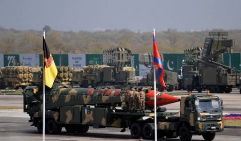 Pakistani military personnel stand beside a Ghauri nuclear-capable missile during a Pakistan Day military parade in Islamabad on March 23, 2017. Pakistan National Day commemorates the passing of the Lahore Resolution, when a separate nation for the Muslims of The British Indian Empire was demanded on March 23, 1940. / AFP PHOTO / AAMIR QURESHI