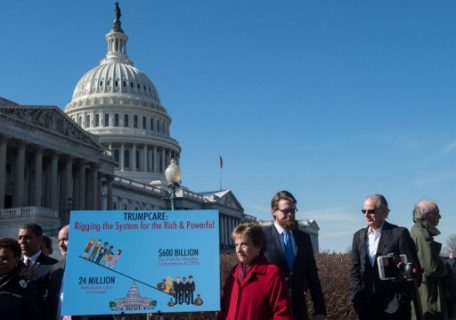A sign is seen during a rally organized by the Congressional Progressive Caucus against the healthcare bill in front of the US Capitol in Washington, DC, on March 23, 2017. / AFP PHOTO / NICHOLAS KAMM