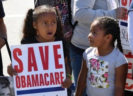 Young protesters march towards the Federal Building during a "Save the Affordable Care Act" rally in Los Angeles, California on March 23, 2017. The march coincides with the seventh anniversary of Obamacare. / AFP PHOTO / Mark RALSTON