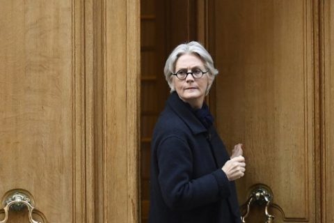 Penelope Fillon, the wife of French presidential election candidate for the right-wing Les Republicains (LR) party, leaves her appartment building on March 27, 2017 in Paris. Penelope Fillon and her husband Francois Fillon are under investigation for a range of charges including alleged embezzlement, as Penelope Fillon is expected for a hearing by investigating judges this week in Paris. / AFP PHOTO / Lionel BONAVENTURE