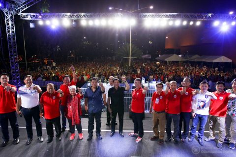 President Rodrigo Duterte, members of the Cabinet, and officers of the Partido Demokratiko Pilipino (PDP) pose for a photo on stage with party members and supporters on their background during the PDP 35th anniversary celebration at the Philippine International Convention Center (PICC) Grounds in Pasay City on March 12, 2017.  (Photo courtesy Presidential Communications)