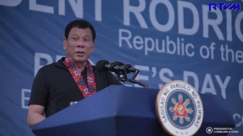 President Rodrigo Duterte speaks before a crowd in Oriental Mindoro on Wednesday./ Screenshot from PCOO video/