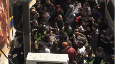 Two President Park Geun-hye supporters are reported dead while injured protesters are removed by emergency services during a protest opposing the Constitutional Court's decision to uphold her impeachment.(photo grabbed from Reuters video)