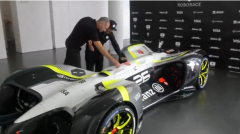 A self-driving electric racing car powered by artificial intelligence is unveiled at the Mobile World Congress in Barcelona.(photo grabbed from Reuters video)