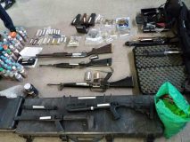 A photo of the unlicensed firearms and ammunition seized by the Quezon City Police from the illegal occupants of 36 Tandang Sora Avenue in Quezon City. (Eagle News Service. Photo provided by QCPD)