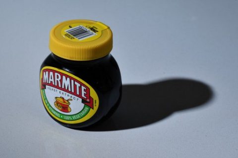 A jar of Marmite is arranged for a photogaph in Brenchley, south east England, on October 13, 2016. British staple Marmite was taken off the virtual shelves at British supermarket Tesco on Thursday, following a reported row with supplier Unilever over pricing after the pound plummeted on fears over the UK's Brexit plans. Jars of Marmite were "currently not available" in the online store of Tesco -- the world's third biggest supermarket chain -- after the company reportedly refused Unilever's request to hike prices. / AFP PHOTO / BEN STANSALL