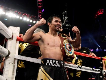 Boxer Manny Pacquiao of the Philippines celebrates after beating Jessie Vargas with a unanimous decision to win the WBO welterweight championship at the Thomas & Mack Center in Las Vegas, Nevada on November 5, 2016. / AFP PHOTO / John GURZINSKI
