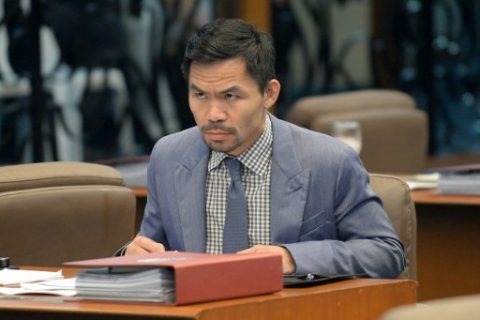 Philippine boxing icon and Senator Manny Pacquiao attends a senate session in Manila on February 13, 2017. Pacquiao on February 13 asked his legions of Twitter followers to choose his opponent after announcing his next world title defence will be in the United Arab Emirates. / AFP PHOTO / TED ALJIBE