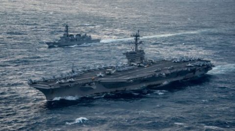 This US Navy handout photo obtained March 15, 2017 shows the aircraft carrier USS Carl Vinson (CVN 70), foreground,as it transits the East China Sea with the Japan Maritime Self-Defense Force Murasame-class destroyer JS Samidare (DD 106) on March 9, 2017. The Carl Vinson Carrier Strike Group is on a western Pacific deployment as part of the US Pacific Fleet-led initiative to extend the command and control functions of US 3rd Fleet.A nuclear-powered US aircraft carrier arrived in South Korea on March 15, 2017 for joint military exercises, the US Navy said, in the latest show of force against the North. The USS Carl Vinson berthed in the southern port of Busan as US Secretary of State Rex Tillerson began a tour of the region, where tensions have spiked in recent weeks with missile launches from the nuclear-armed North and the brazen assassination of Kim Jong-Un's half-brother in Malaysia. / AFP PHOTO / US NAVY / MC2 Sean M. Castellano / RESTRICTED TO EDITORIAL USE - MANDATORY CREDIT AFP PHOTO /US NAVY/MC2 SEAN M.CASTELLANO - NO MARKETING - NO ADVERTISING CAMPAIGNS - DISTRIBUTED AS A SERVICE TO CLIENTS