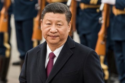 China's President Xi Jinping reviews paramilitary guards with Myanmar's President Htin Kyaw at a welcome ceremony at the Great Hall of People in Beijing on April 10, 2017. / AFP PHOTO / Fred DUFOUR