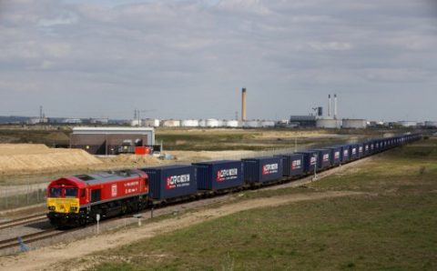 A freight train transporting containers laden with goods from the UK, departs from DP World London Gateway's rail freight depot in Corringham, east of London, on April 10, 2017, enroute to Yiwu in the eastern Chinese province of Zhejiang. The first-ever freight train from Britain to China started its mammoth journey on Monday along a modern-day "Silk Road" trade route as Britain eyes new opportunities after it leaves the European Union. The 32-container train, around 600 metres (656 yards) long, left the vast London Gateway container port laden with whisky, soft drinks and baby products, bound for Yiwu on the east coast of China. / AFP PHOTO / Isabel Infantes