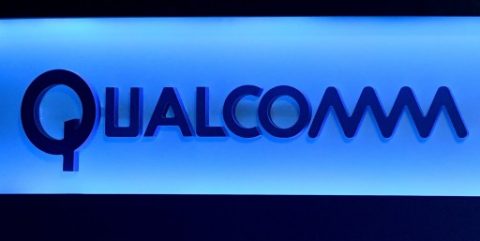 (FILES) This file photo taken on January 5, 2017 shows a Qualcomm sign shown on stage before a keynote address by Qualcomm Inc. CEO Steve Mollenkopf at CES 2017 at The Venetian Las Vegas  in Las Vegas, Nevada.  Qualcomm has moved on the offensive in its legal battle with Apple with a countersuit claiming the iPhone maker breached agreements and encouraged regulatory attacks worldwide on the US computer chipmaker. In a legal filing late April 10, 2017, Qualcomm denied the charges made by Apple in its January lawsuit, while accusing Apple of failing to negotiate in good faith on patent royalties. / AFP PHOTO / GETTY IMAGES NORTH AMERICA / Ethan Miller