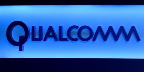 (FILES) This file photo taken on January 5, 2017 shows a Qualcomm sign shown on stage before a keynote address by Qualcomm Inc. CEO Steve Mollenkopf at CES 2017 at The Venetian Las Vegas in Las Vegas, Nevada. Qualcomm has moved on the offensive in its legal battle with Apple with a countersuit claiming the iPhone maker breached agreements and encouraged regulatory attacks worldwide on the US computer chipmaker. In a legal filing late April 10, 2017, Qualcomm denied the charges made by Apple in its January lawsuit, while accusing Apple of failing to negotiate in good faith on patent royalties. / AFP PHOTO / GETTY IMAGES NORTH AMERICA / Ethan Miller