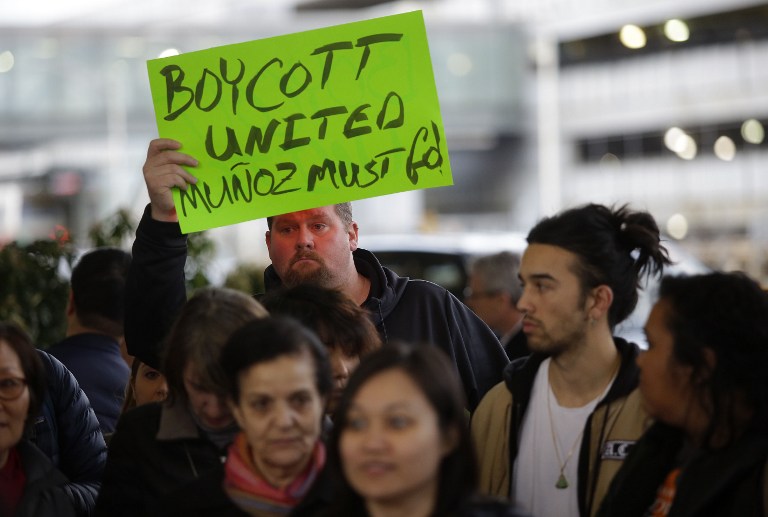 Demonstrators protest United Airlines at O'Hare International Airport on April 11, 2017 in Chicago, Illinois. The protest was in response to airport police officers physically removing passenger Dr. David Dao from his seat and dragging him off the airplane, after he was requested to give up his seat for United Airline crew members on a flight from Chicago to Louisville, Kentucky Sunday night. / AFP PHOTO / Joshua LOTT