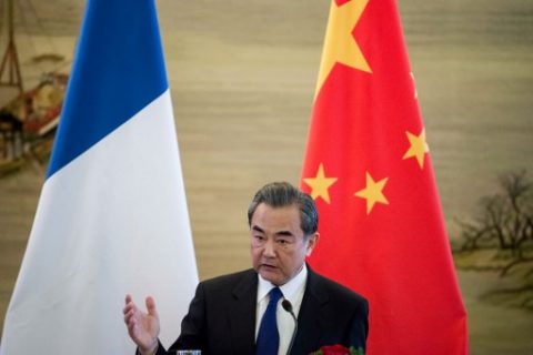 China's Foreign Minister Wang Yi speaks to journalists with his French counterpart Jean-Marc Ayrault during a press conference after their meeting in Beijing on April 14, 2017. China's foreign minister Wang Yi said during a press conference on April 14 that a "conflict could break out at any moment" over North Korea, warning there would be "no winner" in any war, as tensions soar with the US. / AFP PHOTO / Fred DUFOUR
