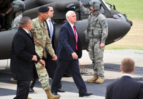 US Vice President Mike Pence (C) arrives at army base Camp Bonifas in Paju near the truce village of Panmunjom during a visit to the Demilitarized Zone (DMZ) on the border between North and South Korea on April 17, 2017. Pence arrived at the gateway to the Demilitarized Zone dividing the two Koreas on on April 17, in a show of US resolve hours after North Korea failed in its attempt to test another missile. / AFP PHOTO / JUNG Yeon-Je