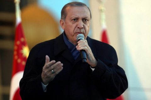 Turkish president Recep Tayyip Erdogan gestures as he delivers a speech to his supporters at the Presidential Palace in Ankara, April 17, 2017 following the results in a nationwide referendum that will determine Turkey's future destiny. Erdogan on April 17 said Turkey could hold a referendum on its long-stalled EU membership bid after Turks voted to approve expanding the president's powers in a plebiscite. Narrowly won by President Recep Tayyip Erdogan, the referendum asked voters to boost the powers of the Turkish head of state -- a move that rights watchdogs have said could fatally weaken democracy in the linchpin country. / AFP PHOTO / ADEM ALTAN