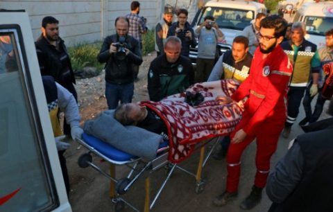 Syrian evacuees from Waer, the last opposition-held district of Syria's third city Homs, arrive in the city of al-Bab in the northern Aleppo province at sunset on April 18, 2017. Hundreds of Syrian civilians who have been under crippling siege left their as evacuations resumed in other areas as well after a weekend bombing killed dozens of others fleeing, nearly 70 of them children, in Aleppo. / AFP PHOTO / Zein Al RIFAI