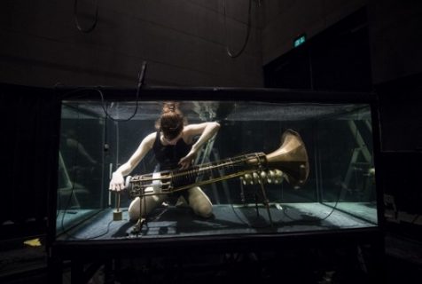 A member of the Between Music band, performs with a custom-made instrument in a glass water tank during a rehearsal ahead of the AquaSonic underwater concert on April 19, 2017 in Aarhus, Denmark. The AquaSonic underwater concert takes the audience on a unique and fascinating voyage into uncharted territory. The work presents five performers who submerge themselves in glass water tanks to play custom-made instruments and sing entirely underwater. Transformed inside these darkly glittering, aquatic chambers, they produce compositions that are both eerily melodic and powerfully resonant. / AFP PHOTO / Jonathan NACKSTRAND