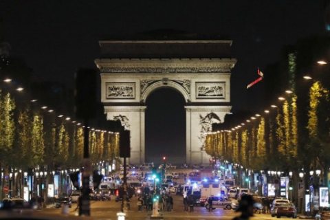 Police officers block the access to the Champs Elysees in Paris after a shooting on April 20, 2017. One police officer was killed and another wounded today in a shooting on Paris's Champs Elysees, police said just days ahead of France's presidential election. France's interior ministry said the attacker was killed in the incident on the world famous boulevard that is popular with tourists. / AFP PHOTO / THOMAS SAMSON