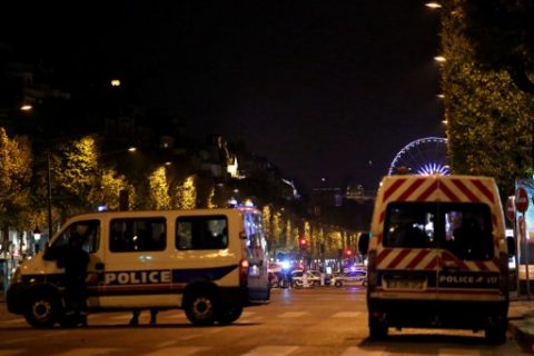 Police officers block the access to the Champs Elysees after a shooting in Paris on April 20, 2017. One police officer was killed and another wounded today in a shooting on Paris's Champs Elysees, police said just days ahead of France's presidential election. France's interior ministry said the attacker was killed in the incident on the world famous boulevard that is popular with tourists. / AFP PHOTO / Benjamin Cremel