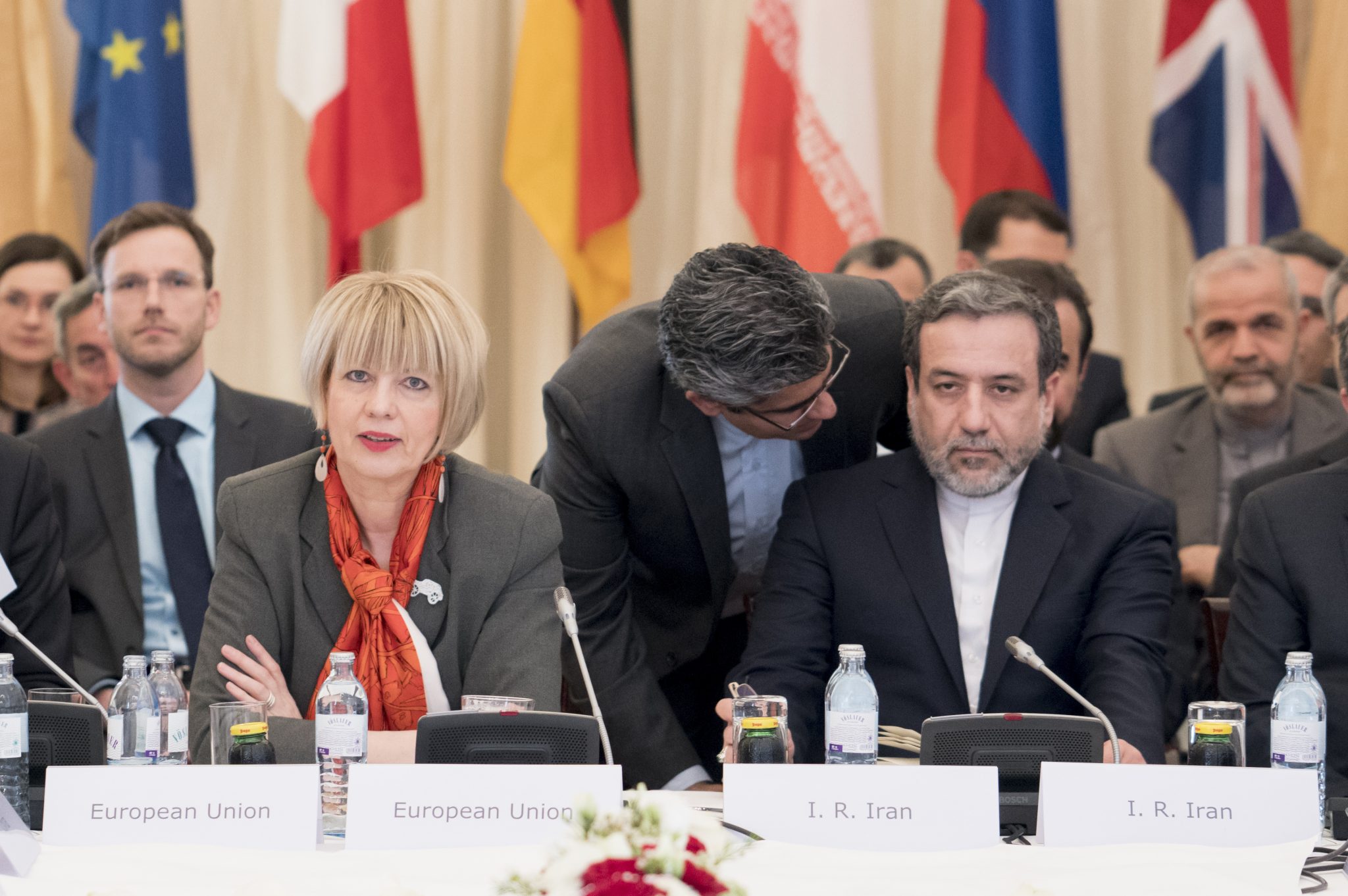 EU senior diplomat Helga Schmid (L), Iranian deputy foreign minister Abbas Araghchi (R) and senior diplomats from other six major powers meet in Vienna, Austria on April 25, 2017 for a regular quarterly meeting to review adherence to their 2015 nuclear deal, as uncertainty grows about the landmark accord's future under US President Trump. Trump said that Iran was 'not living up to the spirit' of the agreement. / AFP PHOTO / JOE KLAMAR