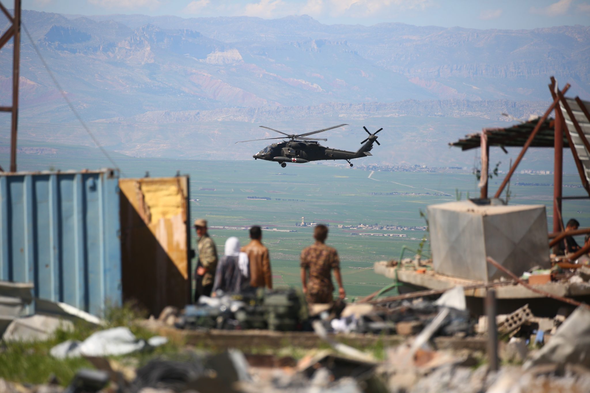 A medical helicopter, from the US-led coalition, flies over the site of Turkish airstrikes near northeastern Syrian Kurdish town of Derik, known as al-Malikiyah in Arabic, on April 25, 2017. Turkish warplanes killed more than 20 Kurdish fighters in strikes in Syria and Iraq, where the Kurds are key players in the battle against the Islamic State group. The bombardment near the city of Al-Malikiyah in northeastern Syria saw Turkish planes carry out "dozens of simultaneous air strikes" on YPG positions overnight, including a media centre, the Syrian Observatory for Human Rights said. / AFP PHOTO / DELIL SOULEIMAN