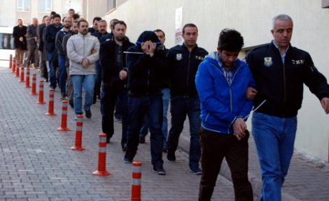 This image obtained from Dogan News Agency (DHA) shows Turkish police officers escorting people after their arrest for alleged links with US-based Muslim cleric Fethullah Gulen on April 26, 2017 in the central city of Kayseri. Turkey detained over 1,000 alleged supporters of US-based Muslim cleric Fethullah Gulen, the biggest crackdown since President Recep Tayyip Erdogan's victory in a referendum on ramping up his powers. A total of 1,009 suspects have so far been detained in raids in 72 provinces across the country, the official Anadolu news agency quoted Interior Minister Suleyman Soylu as saying. / AFP PHOTO / DOGAN NEWS AGENCY / Olcay DUZGUN / Turkey OUT