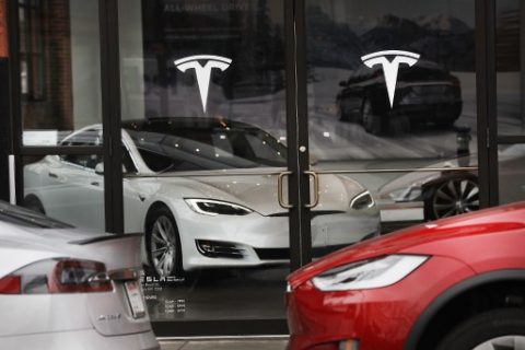 NEW YORK, NY - APRIL 04: A Tesla car is displayed in a showroom at a Brooklyn Tesla dealership on April 4, 2017 in New York City. As of Monday, the start-up car maker founded by Elon Musk had passed iconic car manufacture Ford in market value, riding a 7 percent share-value surge to a market capitalization of about $48.7 billion. Spencer Platt/Getty Images/AFP