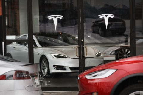 NEW YORK, NY - APRIL 04: A Tesla car is displayed in a showroom at a Brooklyn Tesla dealership on April 4, 2017 in New York City. As of Monday, the start-up car maker founded by Elon Musk had passed iconic car manufacture Ford in market value, riding a 7 percent share-value surge to a market capitalization of about $48.7 billion.   Spencer Platt/Getty Images/AFP