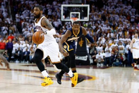 CLEVELAND, OH - APRIL 17: Kyrie Irving #2 of the Cleveland Cavaliers drives past CJ Miles #0 of the Indiana Pacers during the second half in Game Two of the Eastern Conference Quarterfinals during the 2017 NBA Playoffs at Quicken Loans Arena on April 17, 2017 in Cleveland, Ohio. Cleveland won the game 117-111 to take a 2-0 series lead. NOTE TO USER: User expressly acknowledges and agrees that, by downloading and or using this photograph, User is consenting to the terms and conditions of the Getty Images License Agreement. Gregory Shamus/Getty Images/AFP