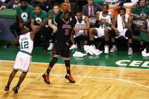 BOSTON, MA - APRIL 18: Dwyane Wade #3 of the Chicago Bulls takes a shot against Terry Rozier #12 of the Boston Celtics during the fourth quarter of Game Two of the Eastern Conference Quarterfinals at TD Garden on April 18, 2017 in Boston, Massachusetts. The Bulls defeat the Celtics 111-97. NOTE TO USER: User expressly acknowledges and agrees that, by downloading and or using this Photograph, user is consenting to the terms and conditions of the Getty Images License Agreement. Maddie Meyer/Getty Images/AFP