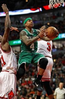 CHICAGO, IL - APRIL 21: Isaiah Thomas #4 of the Boston Celtics drives to the basket between Jimmy Butler #21 (L) and Dwyane Wade #3 of the Chicago Bulls during Game Three of the Eastern Conference Quarterfinals during the 2017 NBA Playoffs at the United Center on April 21, 2017 in Chicago, Illinois. The Celtics defeated the Bulls 104-87.   Jonathan Daniel/Getty Images/AFP