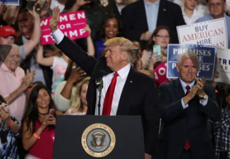 HARRISBURG, PA - APRIL 29: U.S. President Donald Trump (L) acknowledges supporters as Vice President Mike Pence (R) looks on during a "Make America Great Again Rally" at the Pennsylvania Farm Show Complex & Expo Center April 29, 2017 in Harrisburg, Pennsylvania. President Trump held a rally to mark his first 100 days of his presidency.   Alex Wong/Getty Images/AFP