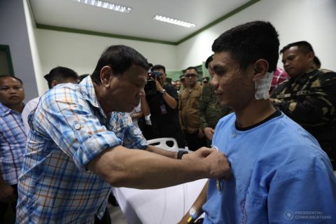 President Rodrigo Roa Duterte awards a Wounded Personnel Medal to First Lieutenant Jose Mari Landicho during his visit to Camp Teodulfo Bautista Station Hospital in Jolo, Sulu on April 6, 2017. ACE MORANDANTE/Presidential Photo