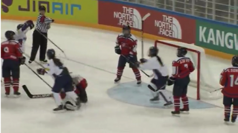 North and South Koreas reunite at a rare game between two rivals North and South Korean women's ice hockey teams in Gangneung.(photo grabbed from Reuters video)