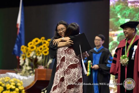 Happy day to be grateful about.  One of the touching scenes at the 42nd NEU graduation ceremonies.  NEU President Dr. Nilo Rosas can be seen in this photo (Photo courtesy NEU official facebook page)