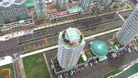 Faculty members of Kim Il Sung University and displaced people move into new flats on Ryomyong Street in Pyongyang.(photo grabbed from Reuters video)