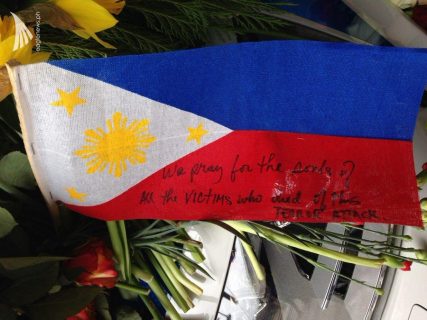 A Philippine flag is among those placed in the area where the victims of the Sweden truck attack are remembered with flowers and notes.  (Photo by Fritzie Joy, Eagle News Service)