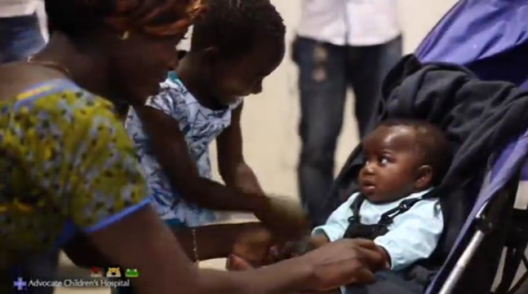 A baby girl born with four legs and two spines returns home to the Ivory Coast after being successfully separated from a parasitic twin in a rare and complex surgery at a Chicago hospital.(photo grabbed from Reuters video)