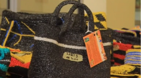 Women in the north-eastern Nigerian city of Yola are making a living from recycling plastic bags and using them to make accessories and household products like baskets for sale.(photo grabbed from Reuters video)
